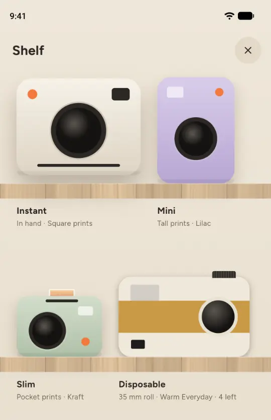 The shelf in Corkie with the Instant, Mini, Slim and Disposable cameras